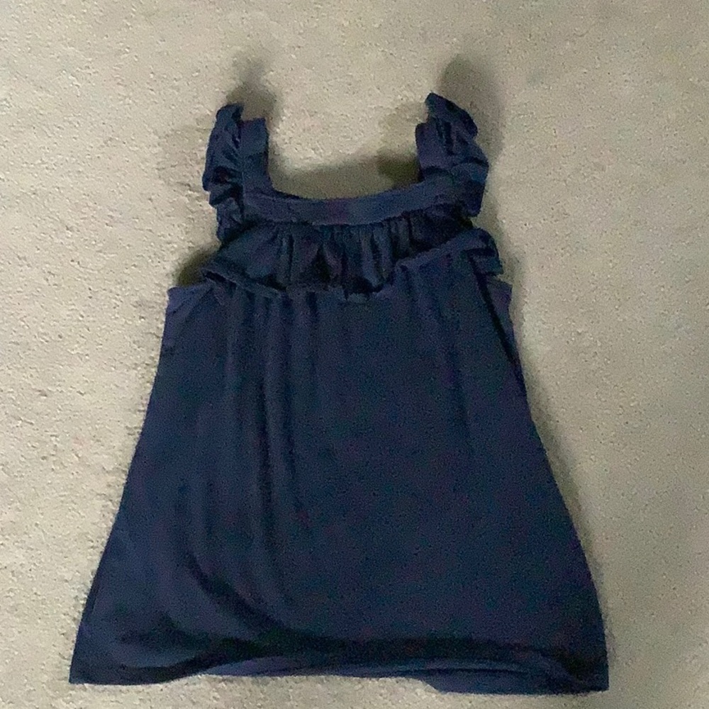 It is a navy blue and it is the brand cat & jack